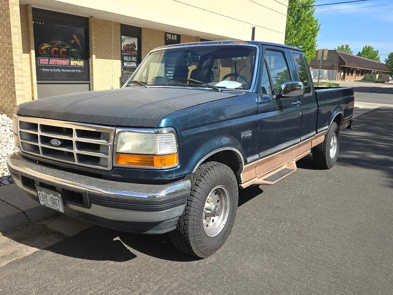 Ford F-150 with sun-faded paint before refinishing