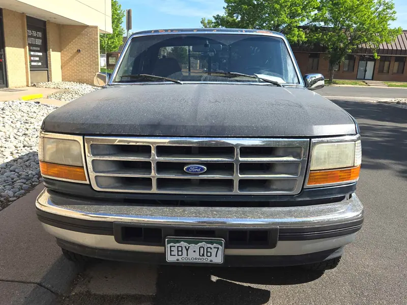 Ford F-150 hood with oxidized, faded paint before refinishing